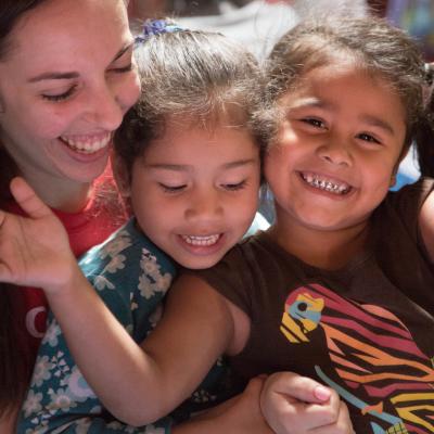 A volunteer on an alternative spring break in Costa Rica plays a game with a child. A volunteer on an alternative spring break in Costa Rica plays a game with a child.